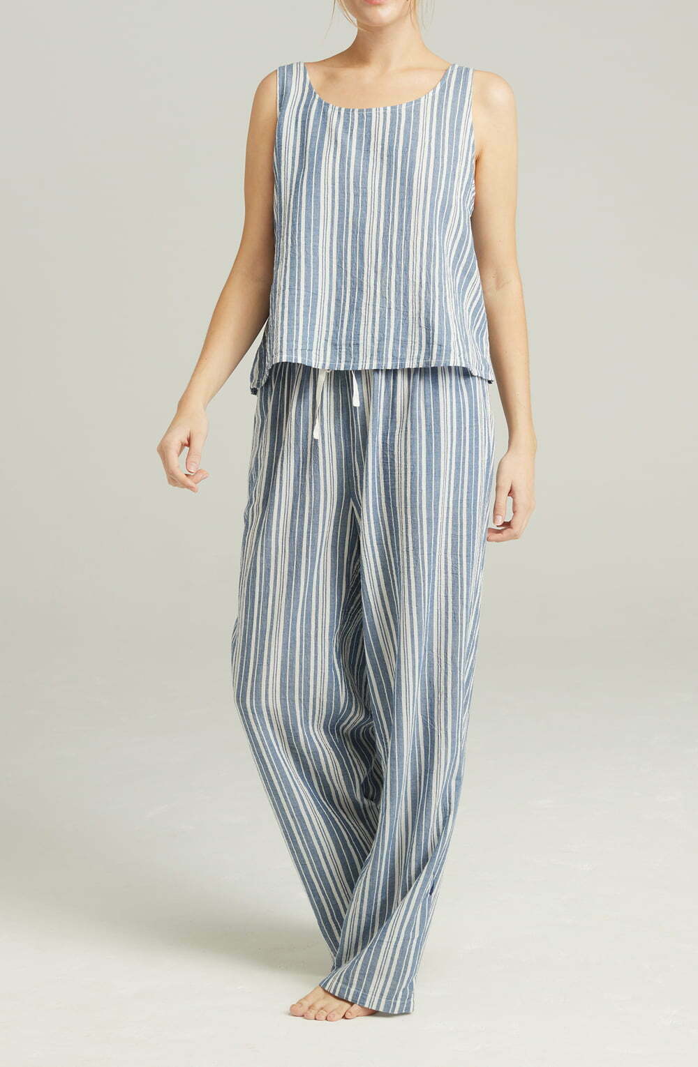 Striped cotton pajama set with relaxed tank top and wide-leg pants, perfect for comfortable lounging.